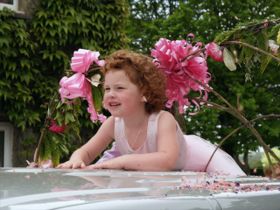 Bridesmaid on car bonnet